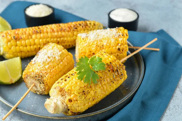 Plate Tasty Grilled Corn Cob Skewers Cheese Blue Background — Stock Photo, Image
