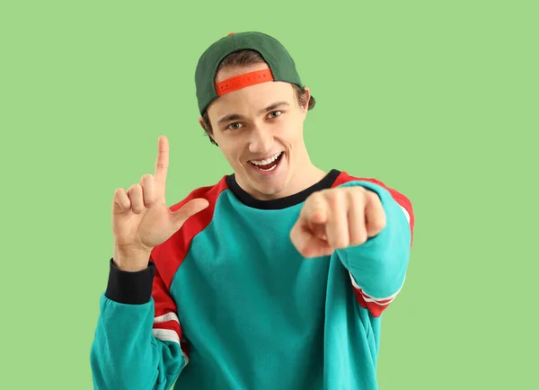 Young Man Showing Loser Gesture Green Background — Stock Photo, Image