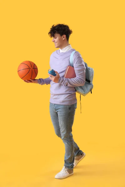 Männlicher Student Mit Ball Limo Und Buch Auf Gelbem Hintergrund — Stockfoto