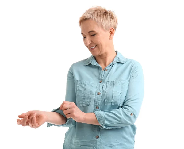 Mature Woman Rolling Her Sleeve White Background — Stock Photo, Image