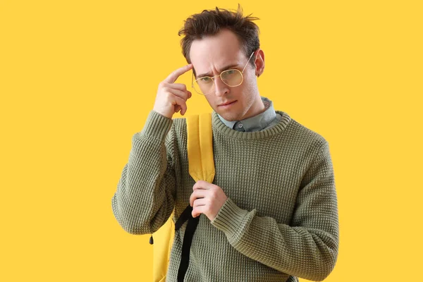 Thoughtful Male Student Yellow Background — Stock Photo, Image
