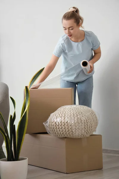 Young Woman Wrapping Cardboard Box Stretch Film Home — Stock Photo, Image