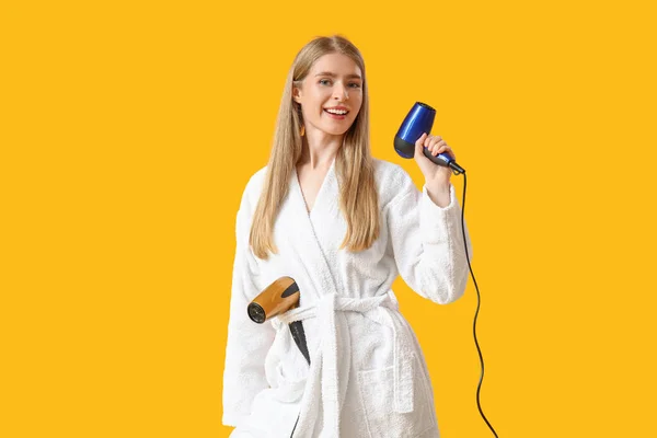 Young Blonde Woman Hair Dryers Yellow Background — Stock Photo, Image