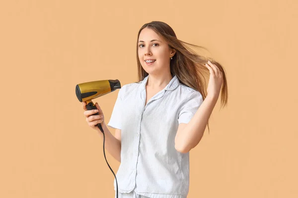 Beautiful Young Woman Hair Dryer Beige Background — Stock Photo, Image