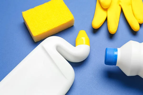 stock image Different cleaning supplies on blue background, closeup