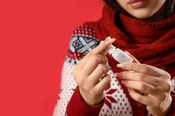 Sick Young Woman Nasal Drops Red Background Closeup — Stock Photo, Image