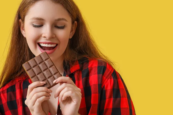 Young Woman Tasty Chocolate Yellow Background Closeup — Stock Photo, Image