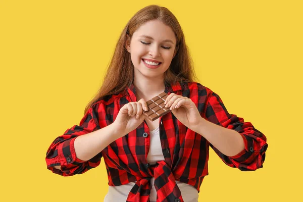 Young Woman Tasty Chocolate Yellow Background — Stock Photo, Image