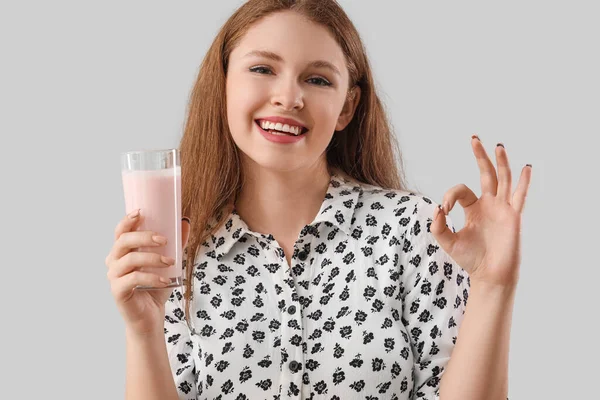 Young Woman Tasty Yoghurt Showing Grey Background — Stock Photo, Image