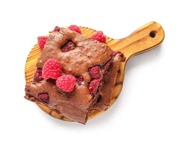 stock image Wooden board with pieces of raspberry chocolate brownie on white background