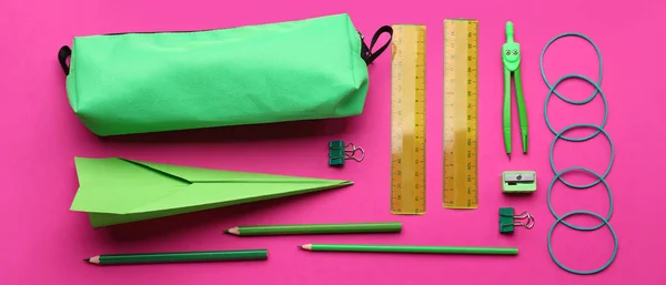 Green Paper Plane School Supplies Pink Background — Stock Photo, Image