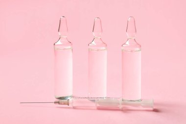 Pembe arka planda tıbbi ampule