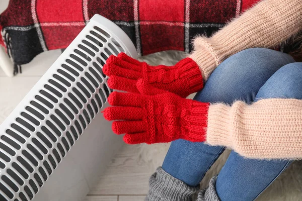 Woman Warming Hands Gloves Radiator Home Closeup — Stock Photo, Image