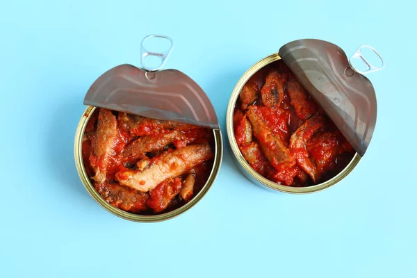 Opened Tin Cans Fish Tomato Sauce Blue Background — Stock Photo, Image