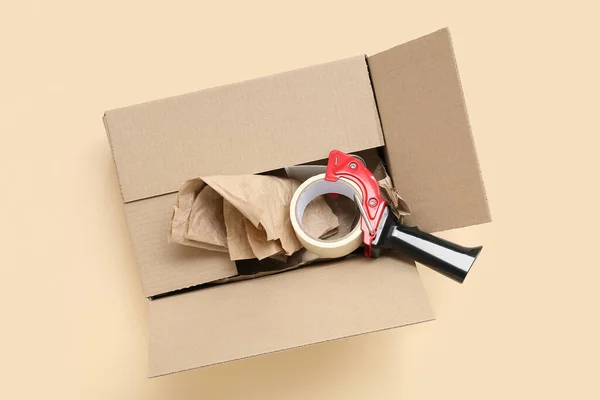 Packing Tape Dispenser Cardboard Box Beige Background — Stock Photo, Image