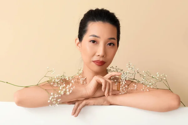 Beautiful Asian Woman Ampule Flowers Beige Background Skin Care Concept — Stock Photo, Image