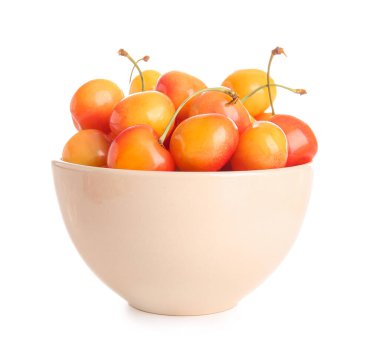 Beyaz arka planda sarı kirazlı bir kase.