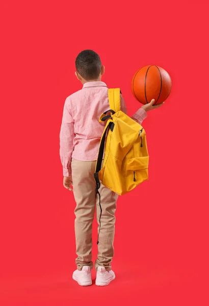 Little African American Schoolboy Ball Backpack Red Background Back View — Stok Foto