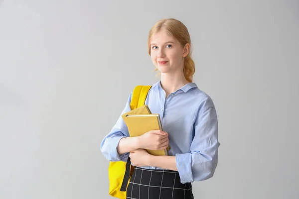 Female Student Backpack Books Grey Background — Stock Photo, Image