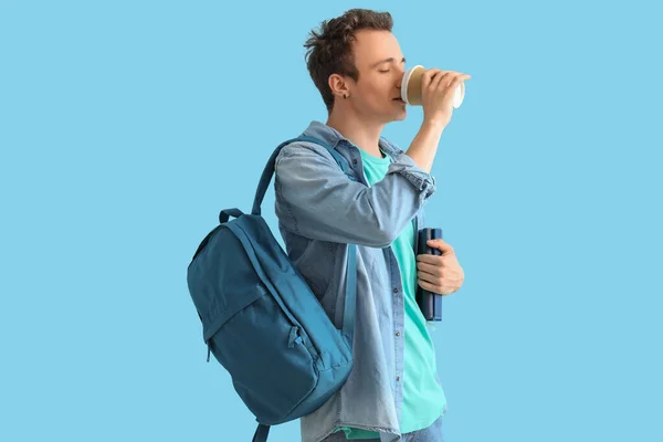 Male Student Backpack Books Drinking Coffee Blue Background — Stock Photo, Image