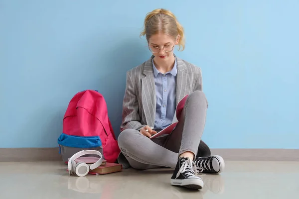 Female Student Backpack Headphones Sitting Blue Wall — Stock Photo, Image