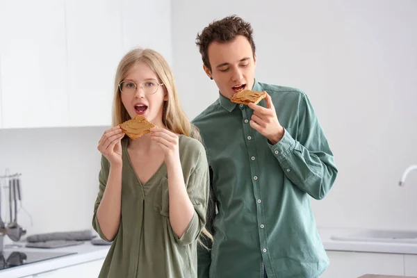 Happy Young Couple Eating Tasty Toasts Nut Butter Kitchen — Stock Photo, Image