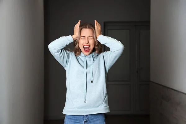 Stressed Young Woman Having Panic Attack Indoors — Stock Photo, Image