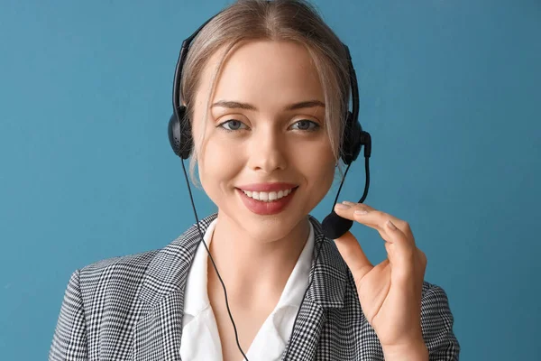 Female technical support agent on blue background