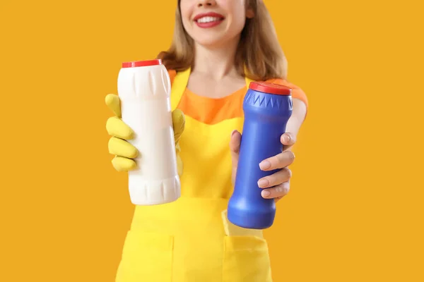 Young Woman Bottles Detergent Orange Background Closeup — Stock Photo, Image