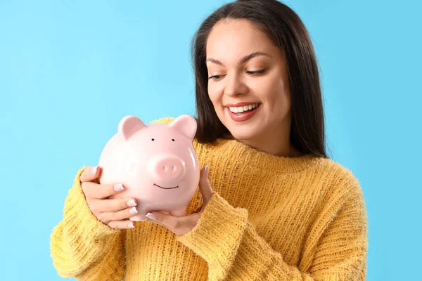 Young Woman Piggy Bank Blue Background Closeup — Stock Photo, Image
