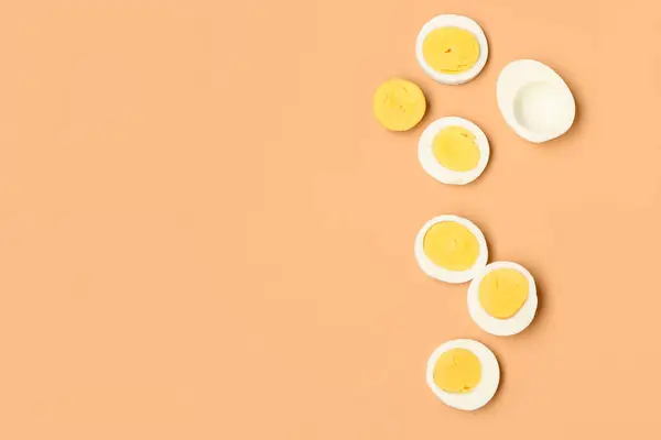Slices Tasty Boiled Eggs Orange Background — Stock Photo, Image