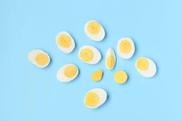 Halves Tasty Boiled Eggs Slice Blue Background — Stock Photo, Image