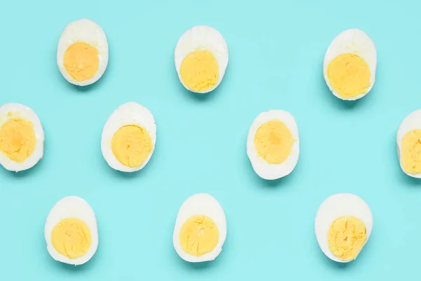 Halves Tasty Boiled Eggs Blue Background — Stock Photo, Image