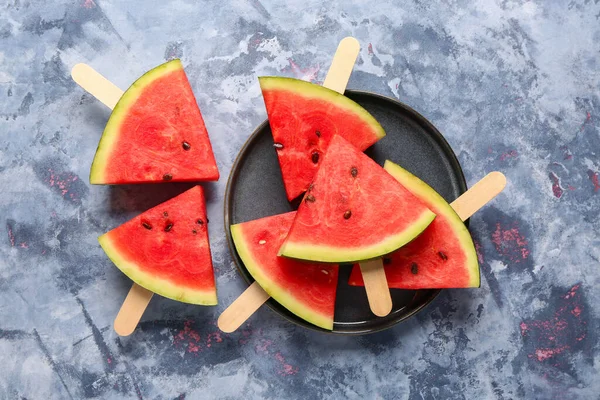 stock image Plate with sweet watermelon sticks on blue background