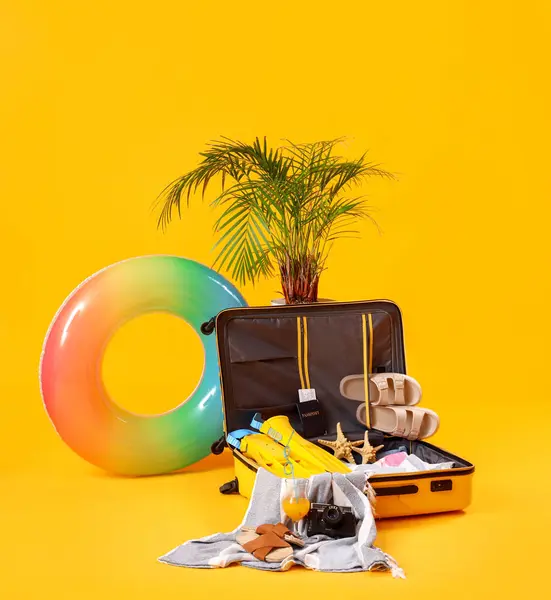 Suitcase Inflatable Ring Fresh Orange Juice Beach Accessories Yellow Background — Stock Photo, Image