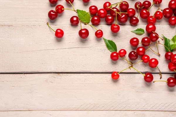 stock image Many red sweet cherries on grey wooden background