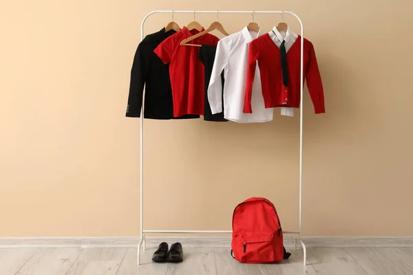Rack Stylish School Uniform Backpack Shoes Color Wall — Stock Photo, Image