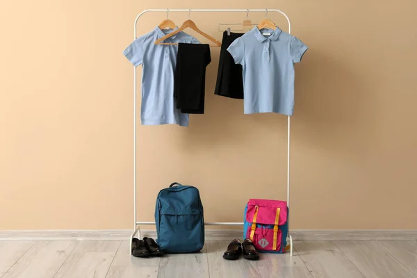 Rack Stylish School Uniform Backpacks Shoes Color Wall — Stock Photo, Image