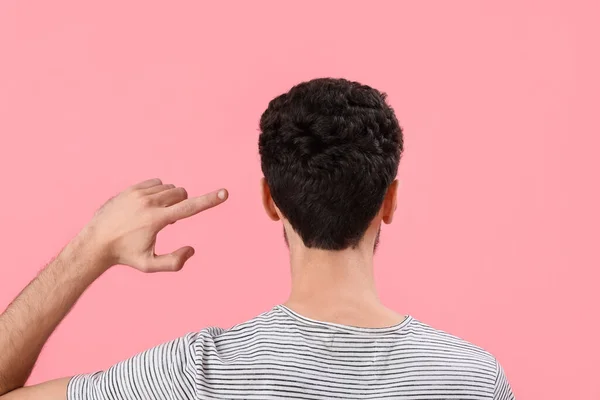 Young Brunette Man Pointing His Hair Pink Background Back View — Stock Photo, Image