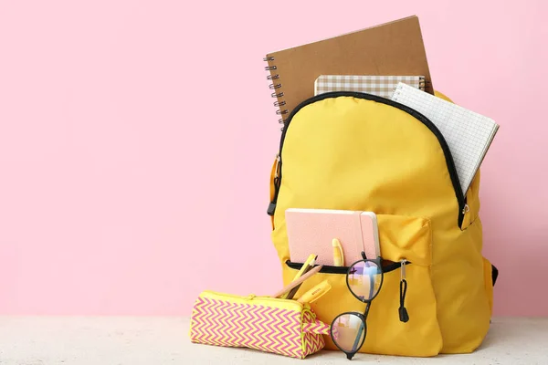 Yellow School Backpack Notebooks Eyeglasses Pencil Case White Grunge Table — Stock Photo, Image