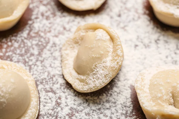 stock image Uncooked dumplings on table, closeup