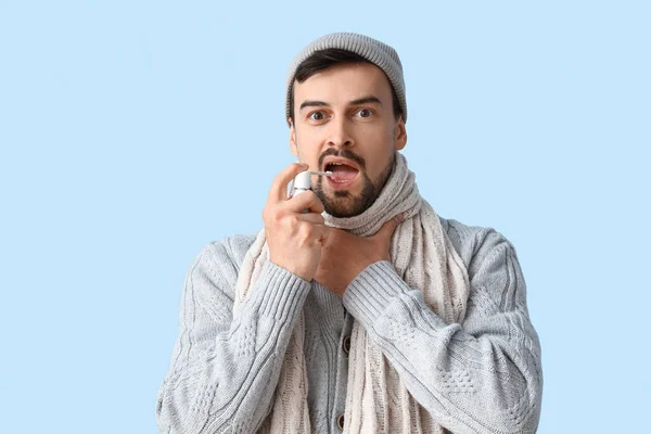 Ill Young Man Spray Sore Throat Blue Background — Stock Photo, Image