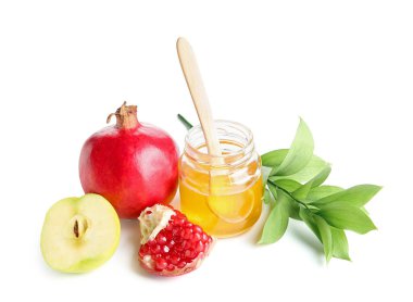 Bir kavanoz bal, taze meyve ve beyaz arka planda bitki dalı. Rosh hashanah (Yahudi Yeni Yılı) kutlaması