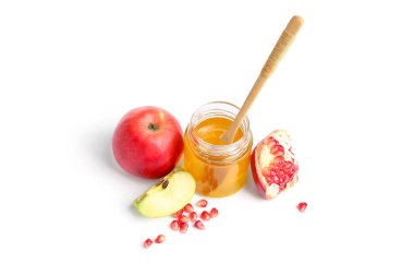 Bir kavanoz bal ve beyaz arka planda taze meyve. Rosh hashanah (Yahudi Yeni Yılı) kutlaması