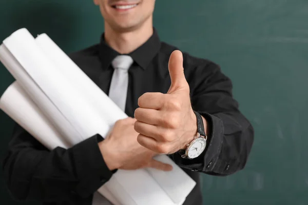 Male Teacher Rolls Paper Showing Thumb Chalkboard Closeup — Stock Photo, Image