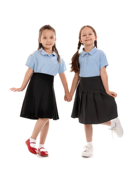 Kleine Schoolmeisjes Witte Achtergrond — Stockfoto