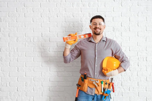 Male Builder Tools White Brick Wall — Stock Photo, Image