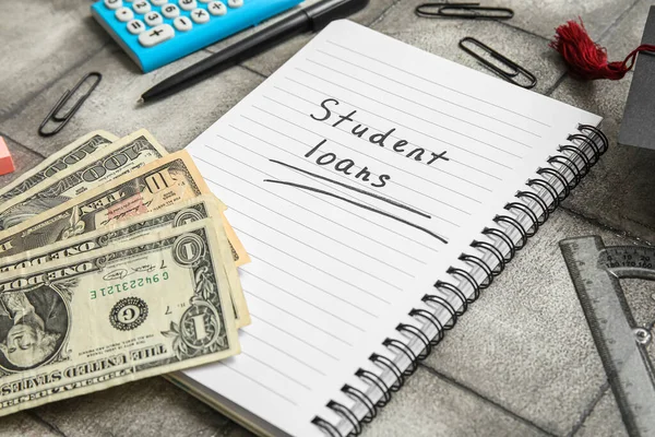 Notebook Text Student Loans Dollar Banknotes Stationery Grey Table — Stock Photo, Image