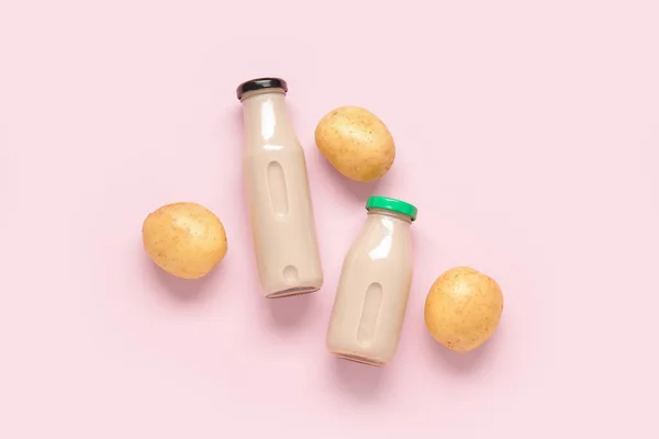 Bottles Tasty Potato Milk Pink Background — Stock Photo, Image