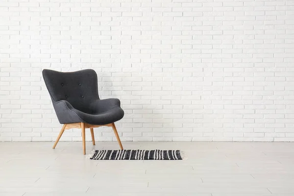 Stylish Black Armchair Carpet White Brick Wall — Stock Photo, Image